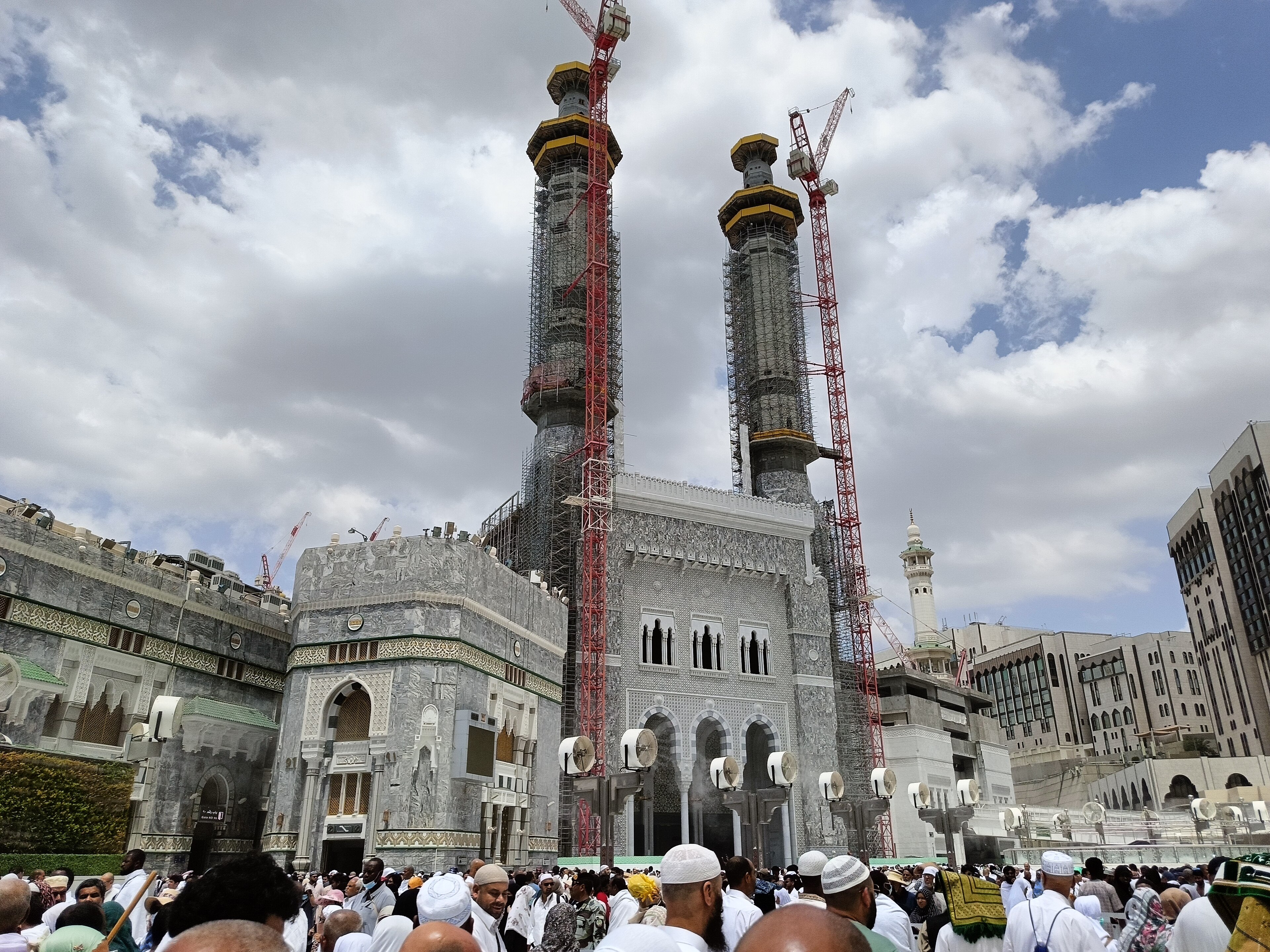 Pilgrims moving through arches near the Haram